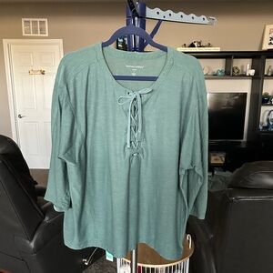 Woman within green tie front quarter length sleeves top. Size Large